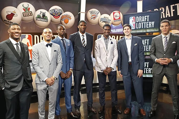 From left, NBA draft prospects Marcus Smart of Oklahoma State, Tyler Ennis of Syracuse, Andrew Wiggins and Joel Embiid of Kansas, Noah Vonleh of Indiana, Doug McDermott of Creighton and Aaron Gordon of Arizona pose for a photograph before the NBA basketball draft lottery in New York, Tuesday, May 20, 2014. (Kathy Willens/AP)
