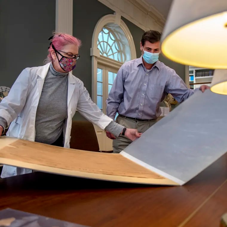 Anne Downey, American Philosophical Society head of conservation, and Patrick Spero, director of the library, open their copy of the original Declaration of Independence ordered up by President John Quincy Adams in 1820, but not completed until 1823.
