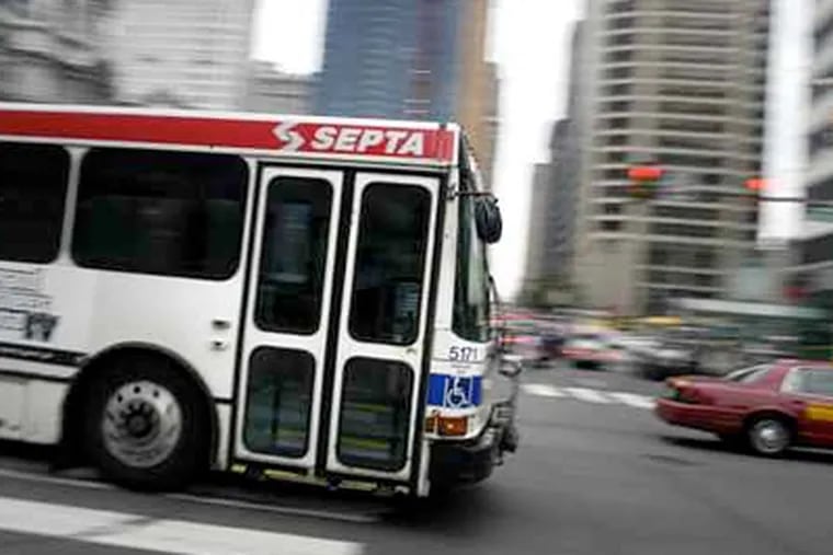 A SEPTA bus drives through Center City near City Hall during morning rush hour May 27, 2008. (Tom Gralish / Staff Photographer)
