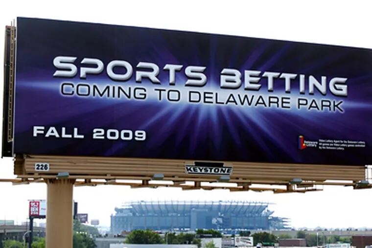 A billboard advertises sports betting in Delaware to drivers traveling southbound on I-95 in South Philadelphia. (David Swanson / Staff Photographer)