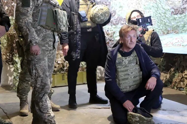 This image provided by Ukrainian Joint Forces Operation Press Service shows actor and producer Sean Penn visiting positions of the Ukrainian Armed Forces near the frontline with Russia-backed separatists in Donetsk region, Ukraine, Nov. 18, 2021. Russia imposed personal sanctions Monday, Sept. 5, 2022 on 25 Americans, including actors Sean Penn and Ben Stiller, in response to U.S. sanctions against Russians stemming from the conflict in Ukraine.