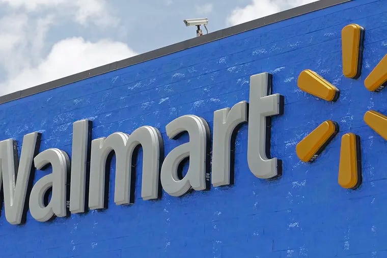 A Walmart sign displayed on the facade of a store in Hialeah Gardens, Fla., on June 1, 2017. Walmart is adding four new fulfillment centers to its existing capacity, a move that will bring more than 4,000 jobs and make next- or two-day shipping available to more Americans.