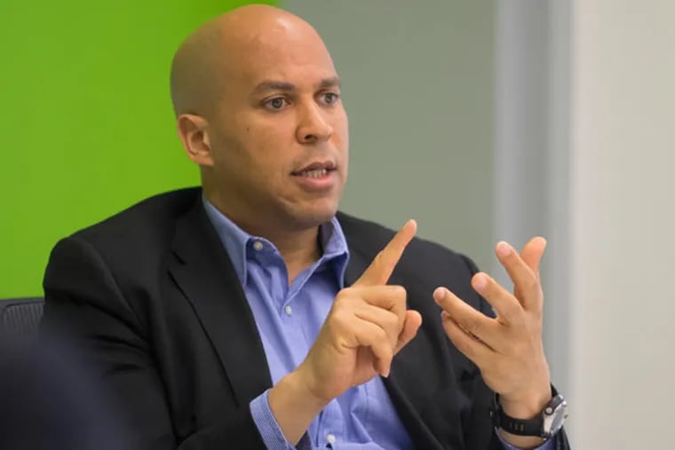 Cory Booker, then candidate for the US Senate from NJ, talks with the Inquirer's editorial board. (Ed Hille / Staff Photographer)