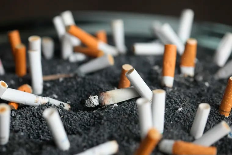 FILE - This March 28, 2019 photo shows cigarette butts in an ashtray in New York. On Wednesday, Jan. 8, 2020, researchers reported the largest-ever decline in the U.S. cancer death rate, and they are crediting advances in the treatment of lung tumors. Most lung cancer cases are tied to smoking, and decades of declining smoking rates means lower rates of lung cancer diagnoses and deaths. (AP Photo/Jenny Kane, File)