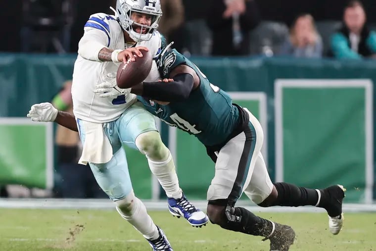 Eagles defensive end Josh Sweat sacks Dallas Cowboys quarterback Dak Prescott late in the fourth quarter on Sunday, November 5, 2023 in Philadelphia.