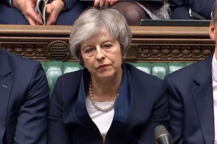 In this grab taken from video, Britain's Prime Minister Theresa May listens to Labour leader Jeremy Corbyn speaking after losing a vote on her Brexit deal, in the House of Commons, London, Tuesday Jan. 15, 2019.  British lawmakers have plunged Brexit into chaos and the U.K. politics into crisis by rejecting Prime Minister Theresa May's divorce deal with the European Union. The 432 to 202 vote in the House of Commons was widely expected but still devastating for May, whose fragile leadership is now under siege. (House of Commons/PA via AP)