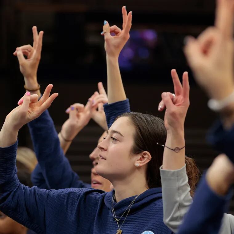 Maddy Siegrist and the Villanova women's basketball team salute the fans after the Selection Sunday show for the women's NCAA Tournament on March 12, 2023 at the Finneran Pavilion at Villanova University.