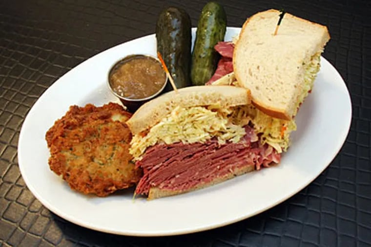 The corned beef special with a side of latkes served with apple sauce and pickles. (Jonathan Yu / Staff Photographer)