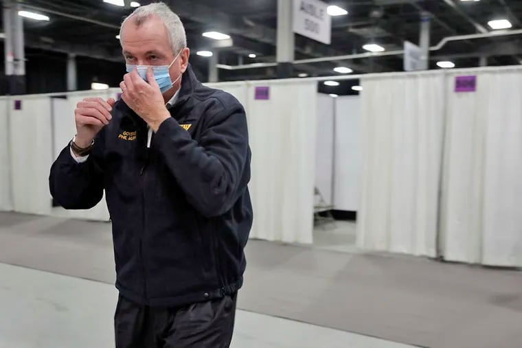 New Jersey Gov. Phil Murphy tours a field medical station in Edison, N.J., on April 8, 2020.