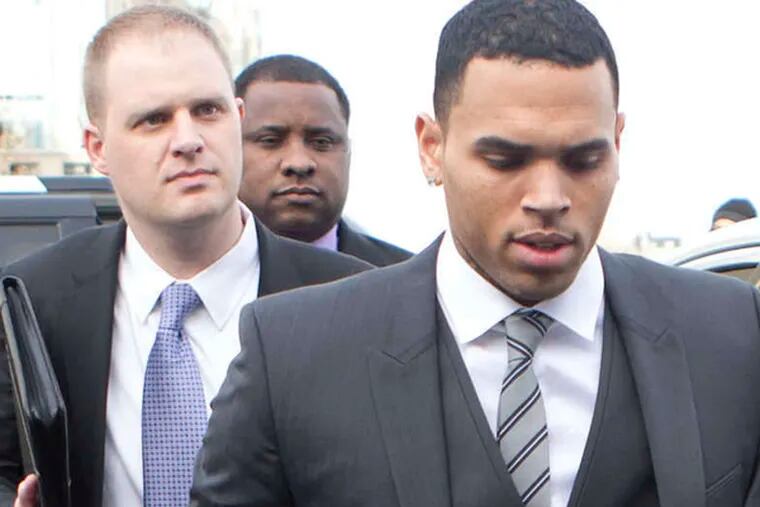 Singer Chris Brown, arrives at the District of Columbia Superior Court in Washington, Wednesday, Jan. 8, 2014, for a status hearing in a case in which he's accused of hitting a man outside a Washington hotel. The R&B singer was arrested in October after a man said the singer hit him outside the W Hotel. Brown and his bodyguard each face a misdemeanor assault charge. (AP Photo/Manuel Balce Ceneta)