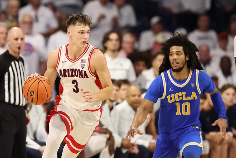 Arizona guard Pelle Larsson (left) tries to dribble around UCLA guard Tyger Campbell during a game earlier this season. UCLA and Arizona are the clear-cut favorites to win this week’s Pac-12 Tournament in Las Vegas. (Photo by Christian Petersen/Getty Images)