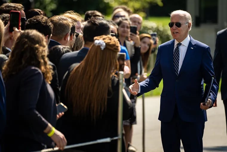 President Joe Biden greets guests after returning to the White House from Rehoboth Beach, Delaware, on Wednesday.