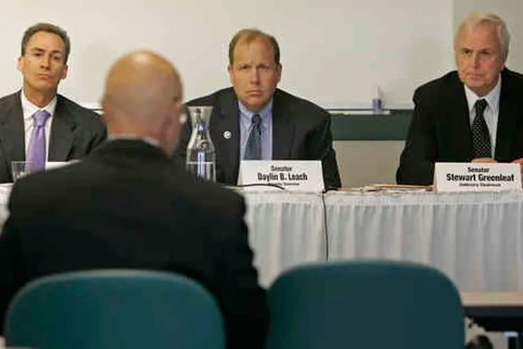 At a hearing on Philadelphia's court system, State Sens. (from left) Michael J. Stack, Daylin B. Leach, and Stewart J. Greenleaf listen to testimony from state Supreme Court Justice Seamus P. McCaffrey.