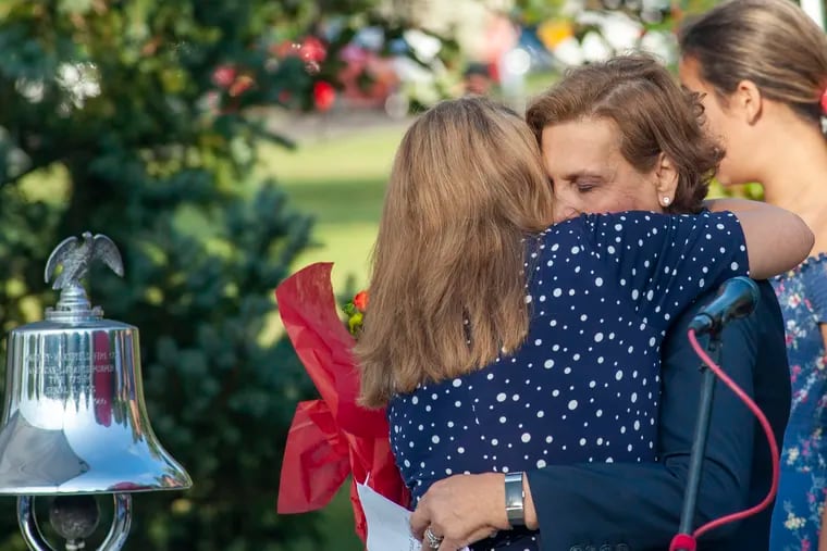 Judi Reiss (right) is hugged by Clara Chich (left) before the 9/11 memorial service Wednesday, September 11, 2019 at Garden of Reflection in Lower Makefield. Judi lost her son, Joshua, in the World Trade Center attack. Today, she is running for Congress.
