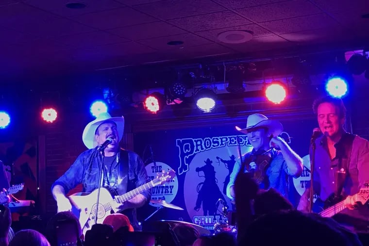 What's Garth Brooks doing playing Prospectors in Mount Laurel during Monday night happy hour? It's the first stop on his two-a-day concert schedule on Dive Bar tour.  He had been scheduled to fly to Foxboro, Mass., for a second show late Monday, but that trip was canceled due to the weather.