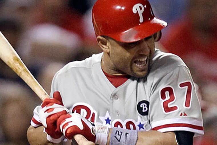 Placido Polanco missed Sunday's game with what manager Charlie Manuel described as "aches and pains." (Jeff Roberson/AP)