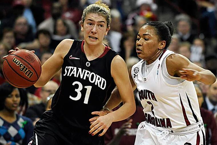 Stanford's Toni Kokenis drives to the basket as South Carolina's Ieasia Walker defends. (Rainier Ehrhardt/AP)