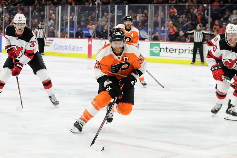 Flyers captain Claude Giroux (center) and the NHL could be playing games again as early as Jan. 13.