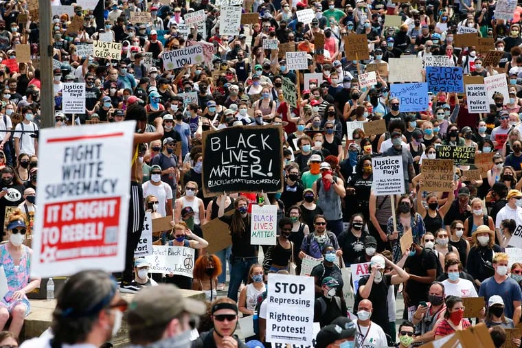 Demonstrators protest social injustice by the police at the Philadelphia Museum of Art along the Benjamin Franklin Parkway on Saturday, June 6, 2020.