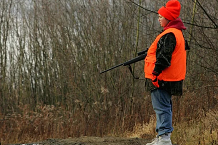 A deer hunter in Moraine State Park, in Butler County. Legislation being debated in a House committee would not open all Sundays to hunting. Instead, the state Game Commission would decide on the Sundays. (Keith Srakocic / Associated Press, File)