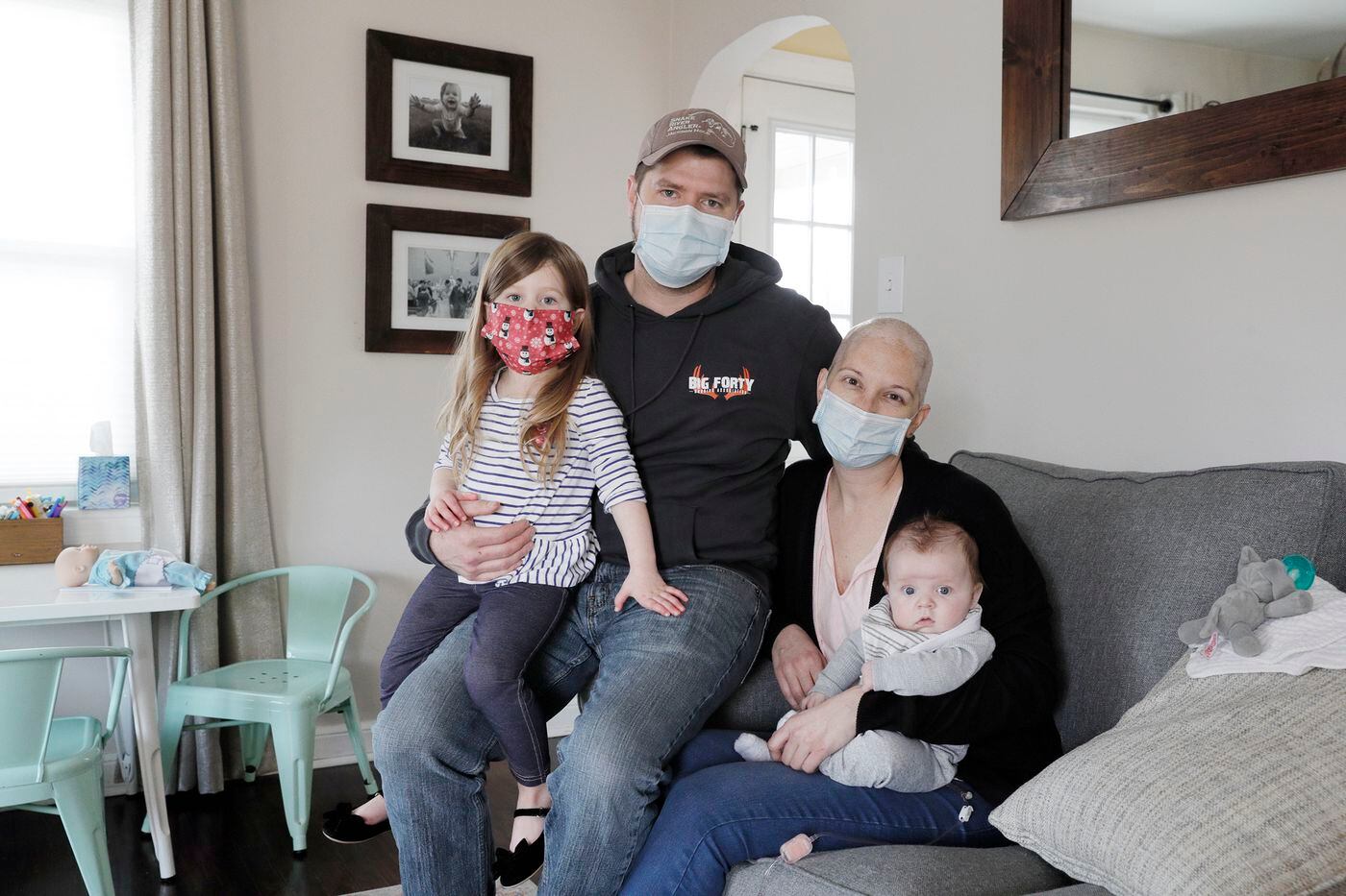 Lisa Oney with her husband, Kevin O’Driscoll, and their children 3-year-old Fiona and 3-month-old Jack. Oney is part of a trend under which more cancer patients are receiving chemotherapy at home. 