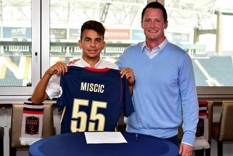 Selmir Miscic (left) with Bethlehem Steel coach Brendan Burke after Miscic, a Philadelphia Union academy product, signed his first professional contract.
