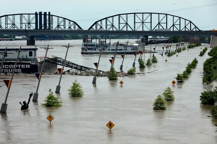 Water from the Mississippi River floods Leonor K. Sullivan Boulevard, Saturday, June 1, 2019, in St. Louis. The Mississippi River is expected to rise several more feet by midweek.