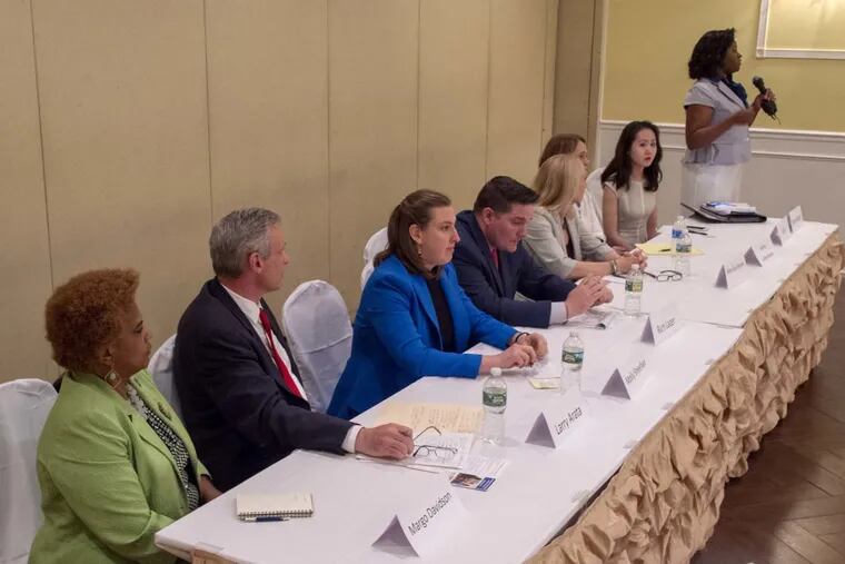 Candidates in the Democratic primary in the Fifth Congressional District debate at Galdo's Catering in South Philly. From front to back: Margo Davidson, Larry Arata, Molly Sheehan, Rich Lazer, Mary Gay Scanlon, Ashley Lukenheimer, Lindy Li, and Theresa Wright, standing.