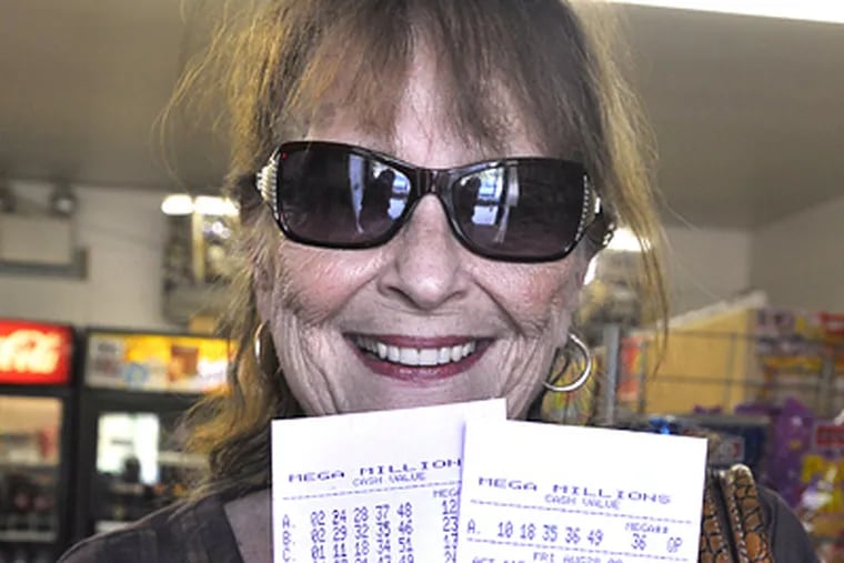 Doris Stieglitz of Cherry Hill displays the Mega Millions tickets she bought at Cherry Hill News Shop. The next drawing is tomorrow in the 12-state lottery. Its prize is the fifth largest in U.S. lottery history. (Sharon Gekoski-Kimmel / Staff Photographer)