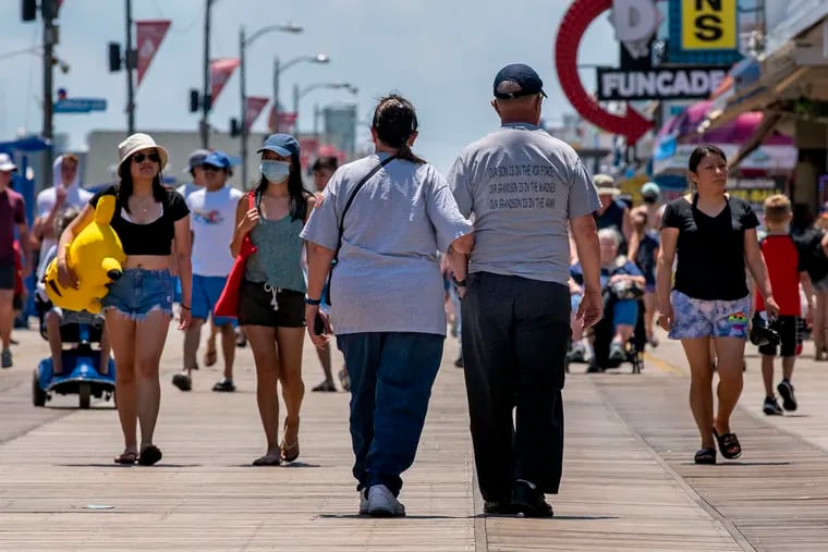 James and Shirley Beck, of Woodbury, N.J., walk on the Wildwood boardwalk on Independence Day. They have been coming to the Shore town now for 53 years.