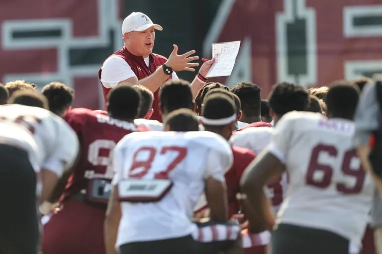 Temple head coach Geoff Collins talks to the team after practice.
