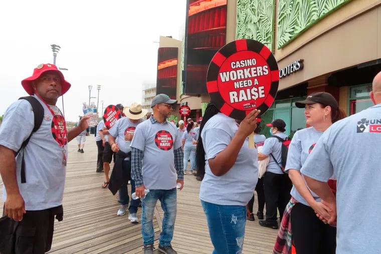 Members of Local 54 of the Unite Here casino workers union picket outside the Tropicana casino in Atlantic City, N.J., on June 1.