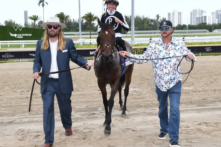Former Phillies outfielder Jayson Werth (left) leads his horse R Calli Kim. His horse Dornoch is an early favorite in the Kentucky Derby.