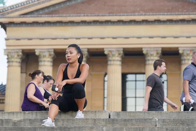 It will feel more the like the middle of July, when this photo was taken of Nicole Lee taking a break from the heat in front of the Art Museum.
