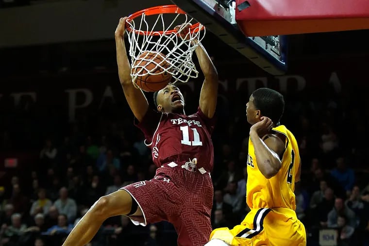 Temple's Trey Lowe gets fouled while dunking the basketball against La
Salle's Amar Stukes.