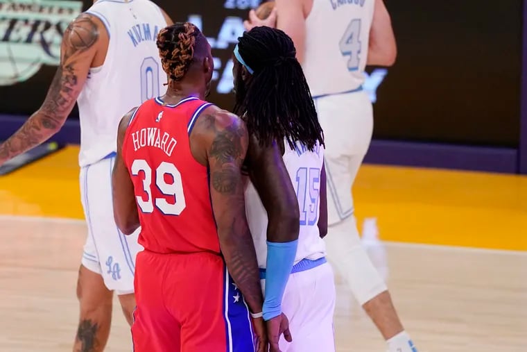 Dwight Howard bumps into Los Angeles Lakers center Montrezl Harrell during a timeout. Howard was ejected moments later.