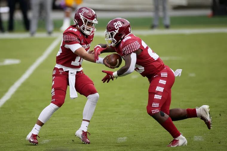Temple quarterback Kamal Gray hands the ball off to running back Tayvon Ruley during a game against East Carolina at Lincoln Financial Field in South Philadelphia on Saturday, Nov. 21, 2020.