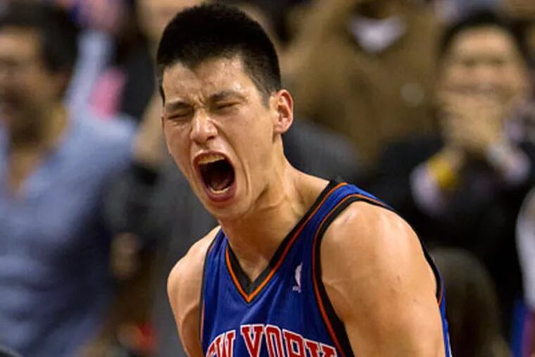 Jeremy Lin celebrates his game-winning 3-pointer against the Raptors. (AP Photo/The Canadian Press, Frank Gunn)