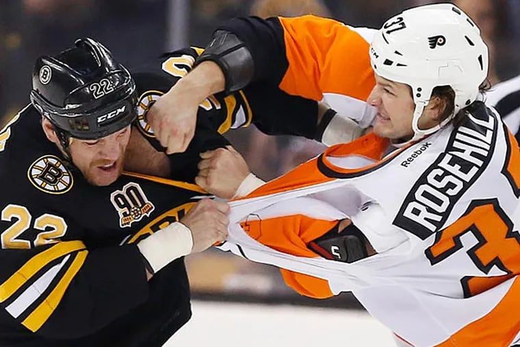 The Bruins' Shawn Thornton (22) and the Flyers' Jay Rosehill (37) fight in the first period of an NHL hockey game in Boston, Saturday, April 5, 2014. (AP Photo/Michael Dwyer)