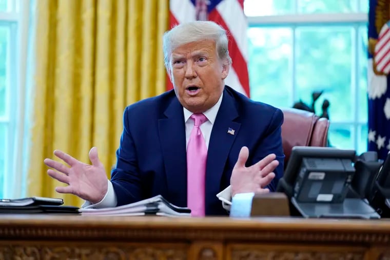 President Donald Trump speaks to the media while meeting with Senate Majority Leader Mitch McConnell and House Minority Leader Kevin McCarthy in the Oval Office at the White House on Monday.