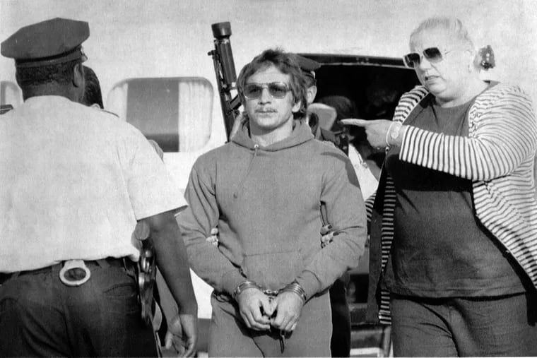 Joseph Kindler gets off a plane at Philadelphia International Airport in September 1991 after his extradition from Canada and is turned over to Philadelphia Police.