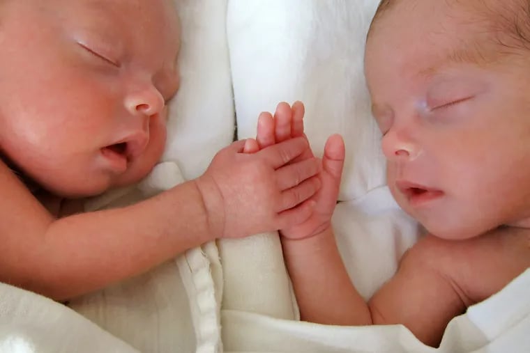 These twins were born prematurely and weighed less than 4 pounds each.
