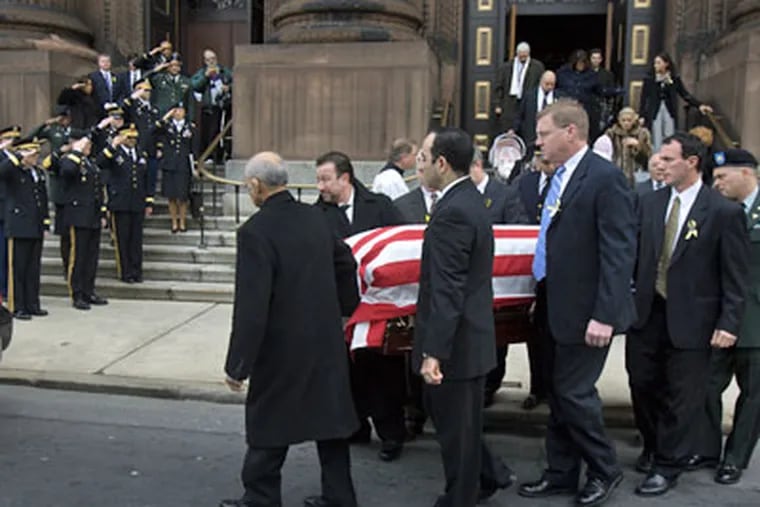 A funeral mass was held Monday for Dr. John P. Pryor, 42, head of the Hospital of the University of Pennsylvania trauma team and a major in the U.S. Army Reserve, who was killed in Iraq on Christmas Day. (Ed Hille / Staff Photographer)