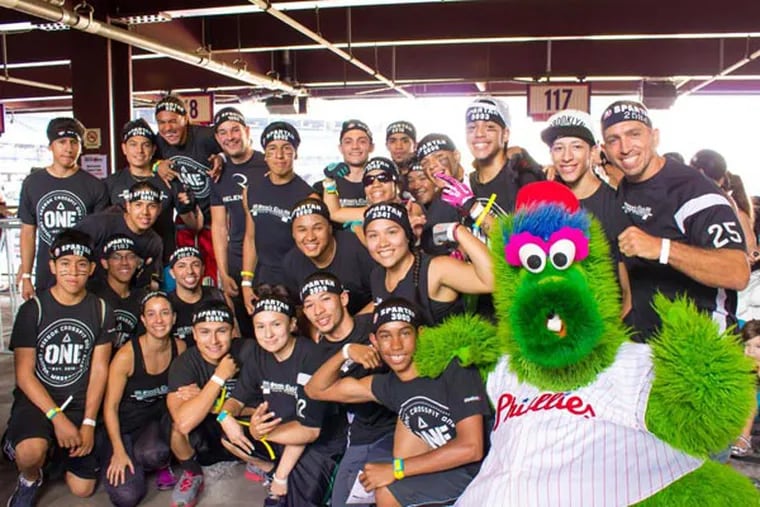 Steve's Club poses with the Phanatic before the Spartan Race. (Patrick Ly)