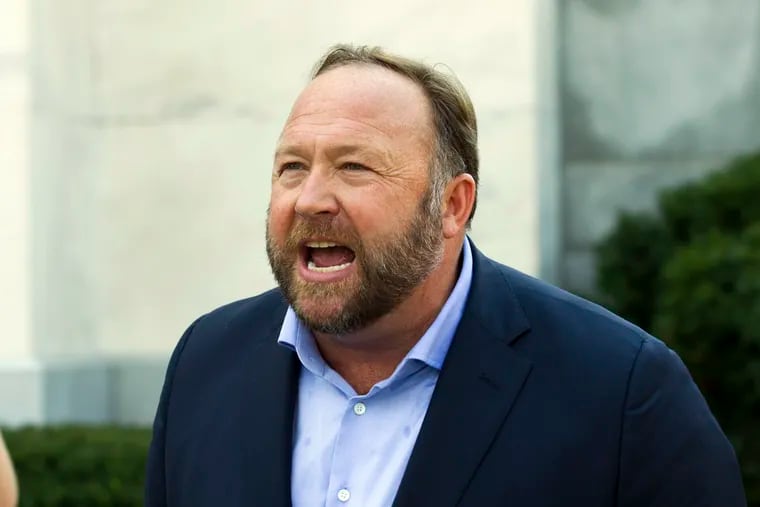 In this Sept. 5, 2018, file photo, Infowars host and conspiracy theorist Alex Jones speaks outside of the Dirksen building on Capitol Hill in Washington. A Connecticut judge has found Jones liable for damages in lawsuits brought by parents of children killed in the Sandy Hook Elementary School shooting. The parents of several children sued Jones over his claims that the massacre was a hoax.