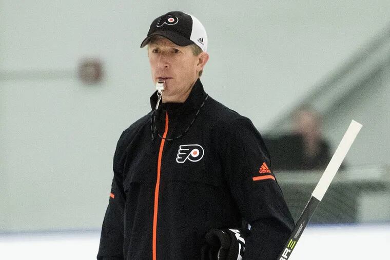 Philadelphia Flyers head coach Dave Hakstol directs practice during NHL training camp, in Voorhees, N.J., Friday, Sept. 15, 2017.