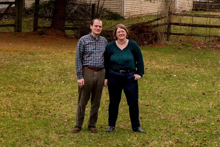 Stephanie and Seth Weidner, who are in the midst of a "collaborative divorce," in the backyard of the Lansdale home they shared during their marriage.
