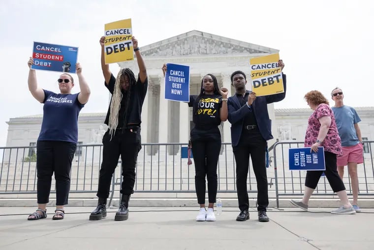 Student loan protesters demonstrate outside the U.S. Supreme Court.