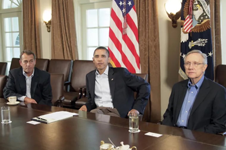 At the White House this month, President Obama met with Senate Majority Leader Harry Reid (right) and House Speaker John A. Boehner to discuss the debt crisis. (Carolyn Kaster / Associated Press)