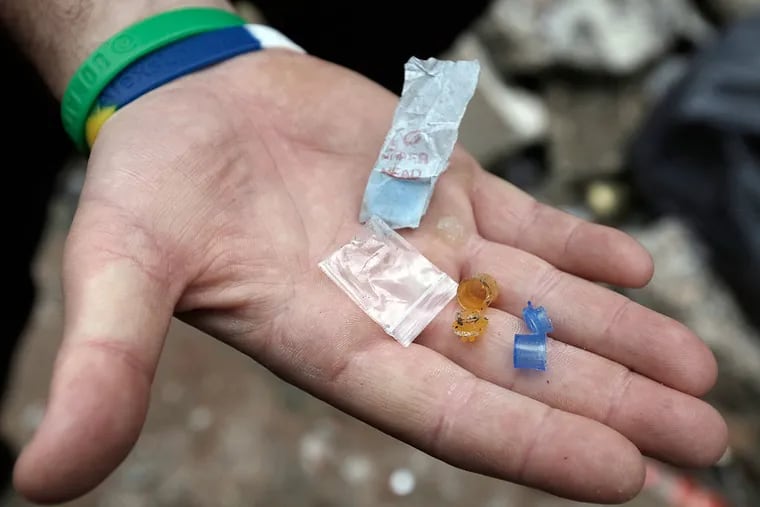 Philadelphia Officer Jeff Stauffer, of the 24th district, finds evidence of heroin and crack use in and around vacant homes in the 200 block of East Stella Street.